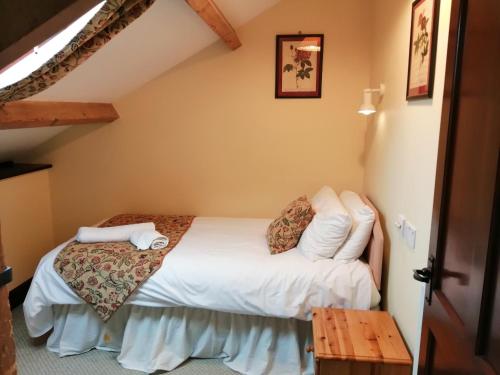 Postel nebo postele na pokoji v ubytování The Old Stables self catering