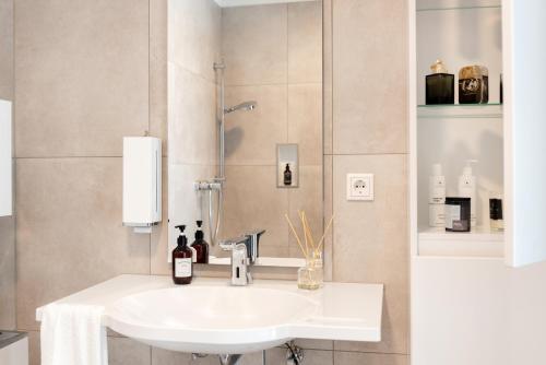 Et badeværelse på MOONLIVING Boutique Apartments by Munich
