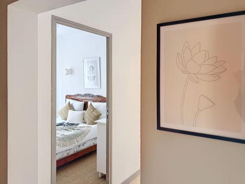 Postel nebo postele na pokoji v ubytování Le Jean - coeur de ville