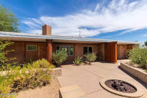 a house with a patio in front of it at Adventure and Serenity in Litchfield Park Sleeps 8 in Litchfield Park