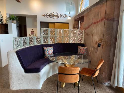 a living room with a couch and a glass table at Adventure and Serenity in Litchfield Park Sleeps 8 in Litchfield Park