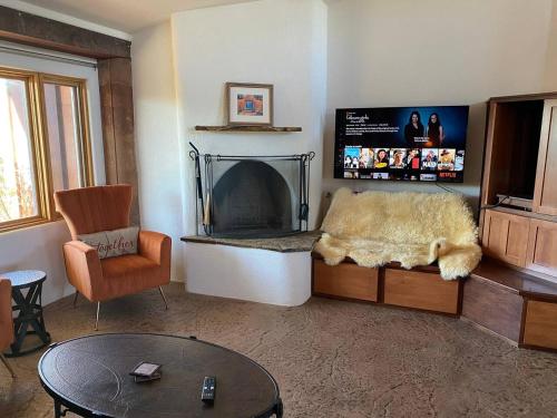 a living room with a couch and a fireplace at Adventure and Serenity in Litchfield Park Sleeps 8 in Litchfield Park