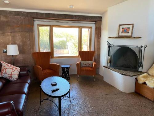 a living room with a couch and a fireplace at Adventure and Serenity in Litchfield Park Sleeps 8 in Litchfield Park