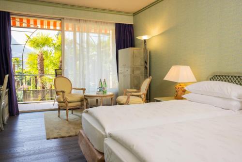 Postel nebo postele na pokoji v ubytování Grand Hotel Villa Castagnola