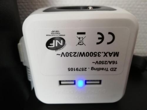 a close up of a white toaster with a blue light at Kokodor in De Haan