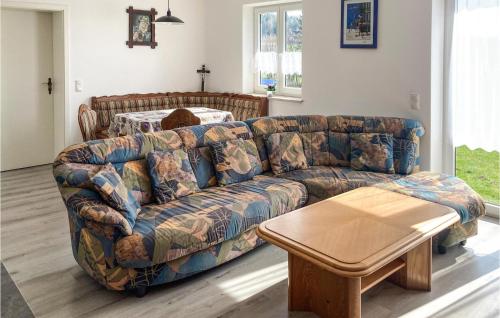 a living room with a couch and a table at Holiday Home Wiesenfelden - 08 in Wiesenfelden