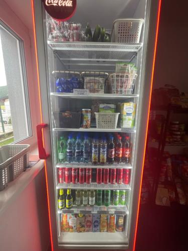 a refrigerator filled with lots of sodas and drinks at Appartement Sabrina in Steinberg am Rofan