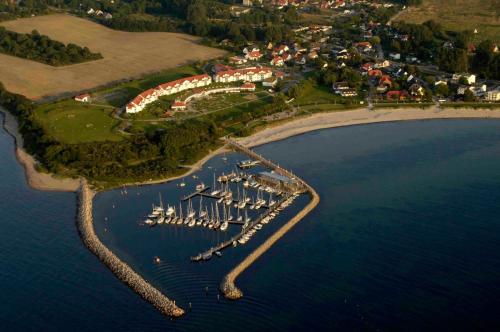 an aerial view of a marina with boats in the water at Gasthaus & Pension "Zur Schaabe" in Glowe