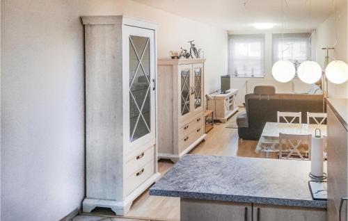 a kitchen and living room with a large cabinet at 1 Bedroom Nice Apartment In Barth in Barth