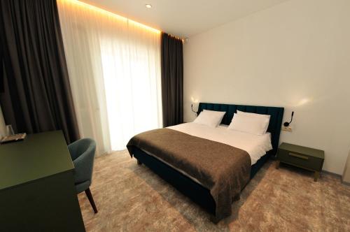 Una cama o camas en una habitación de Hotel Kazak Club