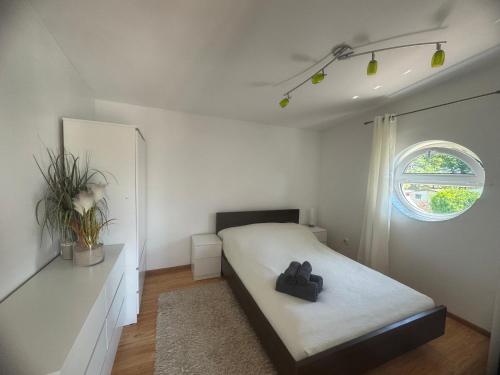 Postel nebo postele na pokoji v ubytování Domek Łeba Nowęcin