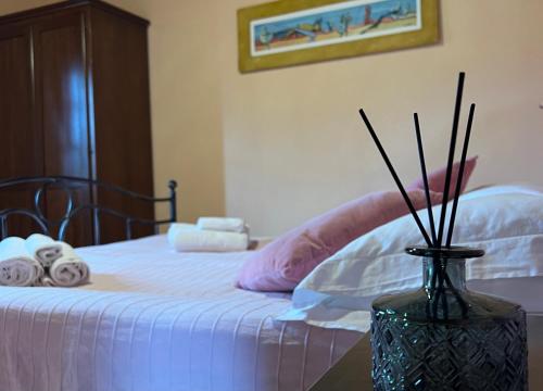 Postel nebo postele na pokoji v ubytování Agriturismo Melodie Toscane Sorano