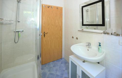 a white bathroom with a sink and a shower at Gorgeous Home In Waldthurn With Wifi in Waldthurn