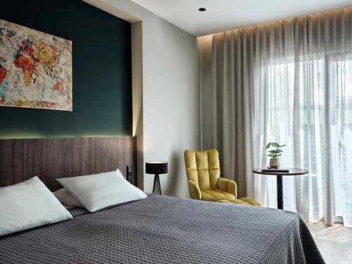 Postel nebo postele na pokoji v ubytování Candia Hotel
