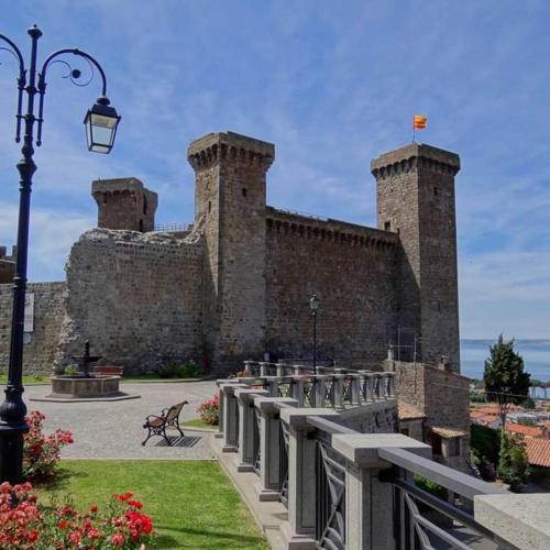 a large brick building with a street light in front of it at Casa Vacanze Emmanuele in Porano