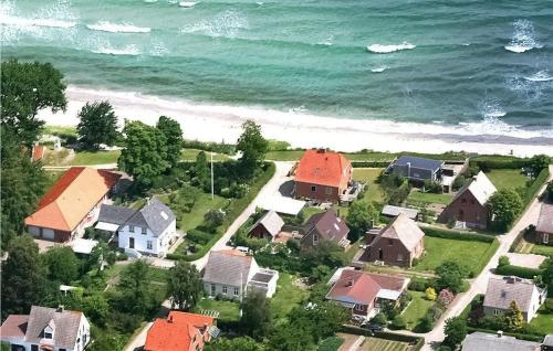 an aerial view of a residential neighborhood next to the ocean at Gorgeous Home In Samsø With Wifi in Ballen