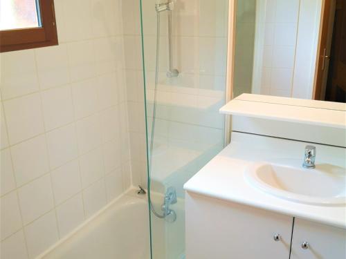 a bathroom with a sink and a shower at Chalet Mitoyen 7p avec Piscine, Sauna, Parking Gratuit et Proche Commerces - FR-1-504-67 in Le Dévoluy