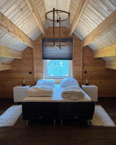Ένα ή περισσότερα κρεβάτια σε δωμάτιο στο Vakantiehuis aan bosrand in Eifel nabij Cochem-Zell aan de Moezel - Dichtbij De Calmont Klettersteig Bremm - Green House