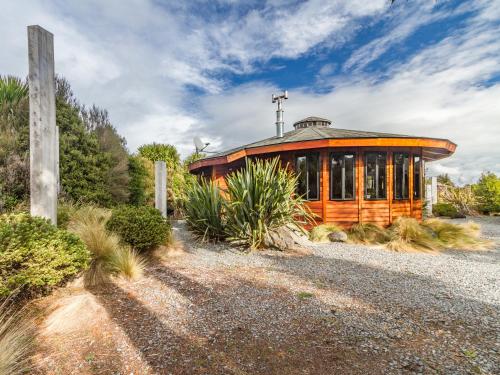 a large wooden building with a cross on top of it at Turoa Yurt - Ohakune Holiday Home in Ohakune