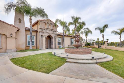 a mansion with a fountain in the yard at 10 Mi to Dtwn Riverside Triplex with Pool in Riverside