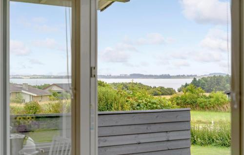 an open window with a view of the water at 3 Bedroom Stunning Home In Snedsted in Snedsted
