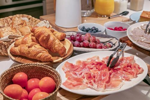 a table topped with plates of food and pastries at CAN SAFRA in La Pera