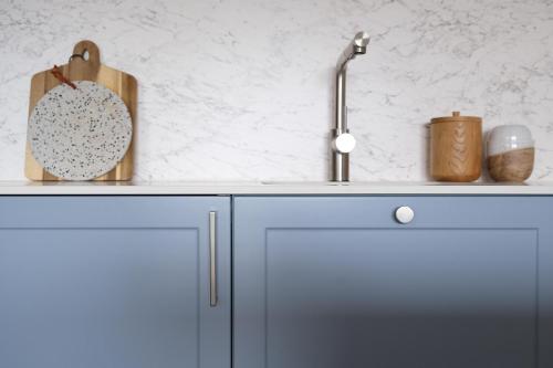 a kitchen with a sink and a counter top at VIP Apartament Kopisto CENTRUM in Rzeszów