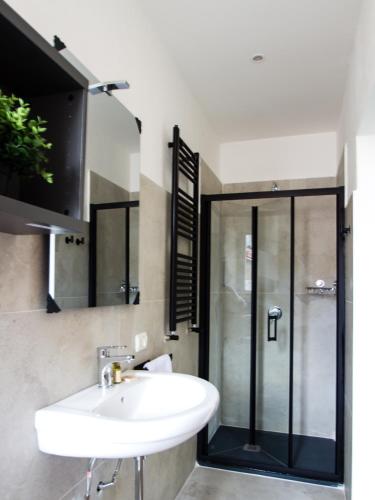a bathroom with a sink and a shower at Your Refuge in Lecco - Lake Como in Lecco