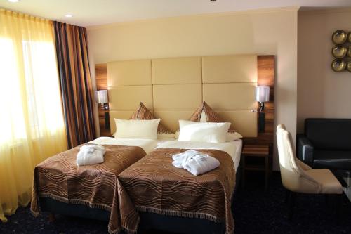 Postel nebo postele na pokoji v ubytování Grand Hotel Empire