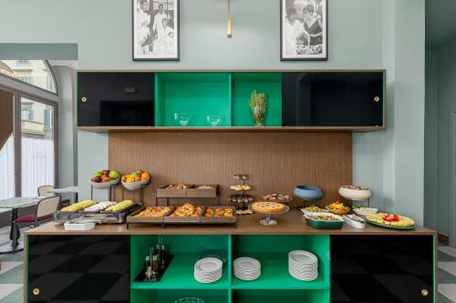 a buffet with many different types of food on display at Room Mate Luca, Florence in Florence