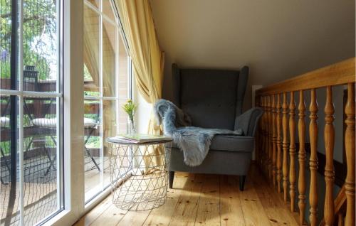 a room with a chair and a table and a window at Amazing Home In Duingen With Wifi in Duingen