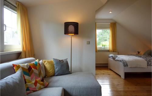 a living room with a couch and a bed at Amazing Home In Duingen With Wifi in Duingen