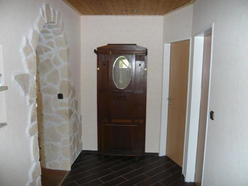 a hallway with a wooden elevator in a room at Ferienhaus für 7 Personen ca 90 m in Marschacht, Hamburg und Umgebung in Marschacht