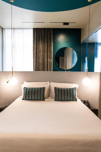 Ένα ή περισσότερα κρεβάτια σε δωμάτιο στο Relais sul Mare Boutique Hotel