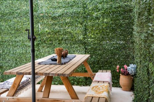 a wooden table with cactuses on top of it at Aggire Zante Retro Residence in Zakynthos Town