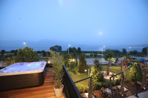 a hot tub on the balcony of a resort at Toka Hotel Restaurant in Pogradec