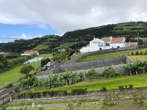 a house on top of a hill with a road at Casa da Adega in Ribeira Chã