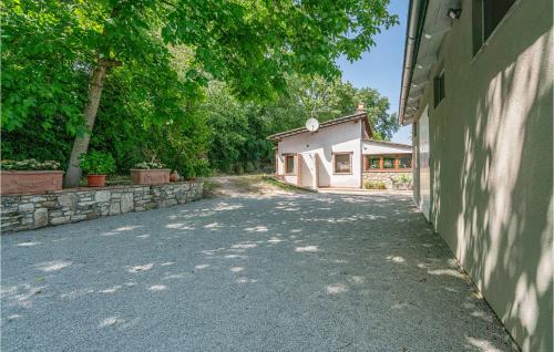 an empty driveway in front of a house at 2 Bedroom Awesome Home In Orte in Orte