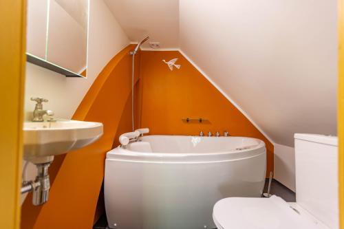 a bathroom with a toilet and a sink at Mönus Pesa in Kuressaare