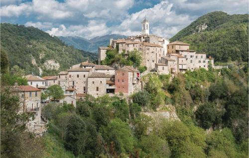 a group of buildings on a hill with trees at Il Seminario in Collevecchio