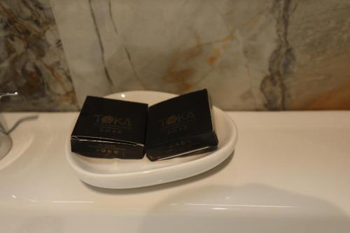 a black box on a plate on a table at Toka Hotel Restaurant in Pogradec