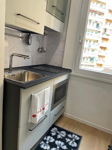 a small kitchen with a sink and a sink at Wow Rome Home in Rome