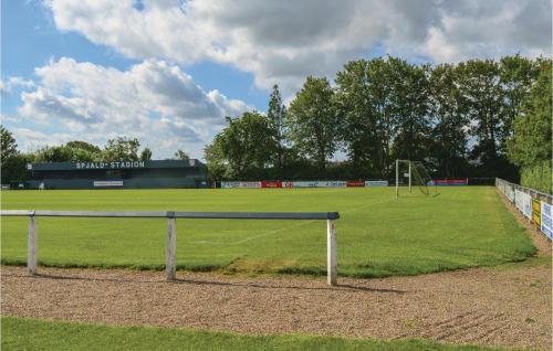 a soccer field with a net in the middle of a field at Holiday Home Halvejen Hytte Spjald Xi in Spjald