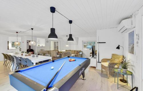a living room with a pool table at Lovely Home In Ulfborg With Sauna in Ulfborg