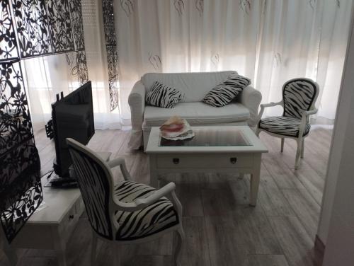 Ένα ή περισσότερα κρεβάτια σε δωμάτιο στο Paradise of Dreams Apartamentos - EL SOLO ÁTICO