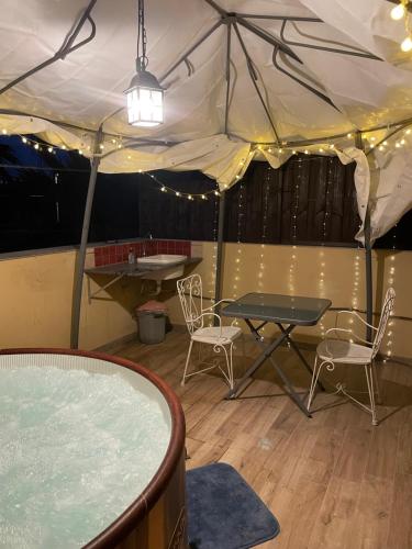 a tent with a table and chairs in a room at B&B Etna Country in Tremestieri Etneo
