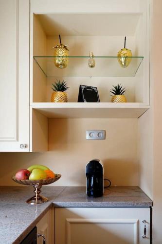 a kitchen with a bowl of fruit on a counter at Minho Valley in Caminha