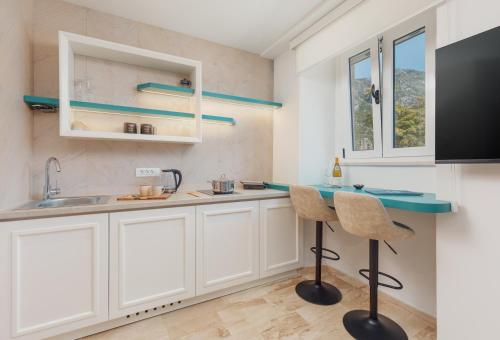 Dapur atau dapur kecil di Tramontana Apartments