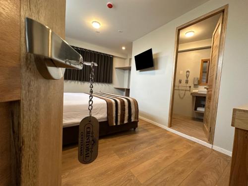 a hotel room with a bed and a mirror at CASA CRISTOBAL Centenario in Cusco