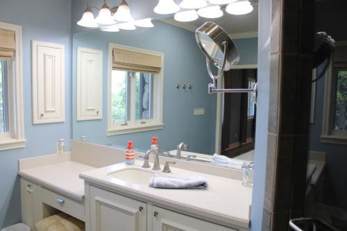 a bathroom with a sink and a mirror at Stony Point Gated Resort in Jay